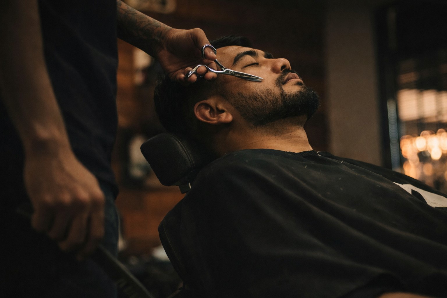 Man sitting on barber chair